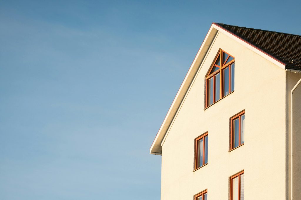 pexels photo 358636 358636 Minimalist modern residential building facade against clear blue sky.